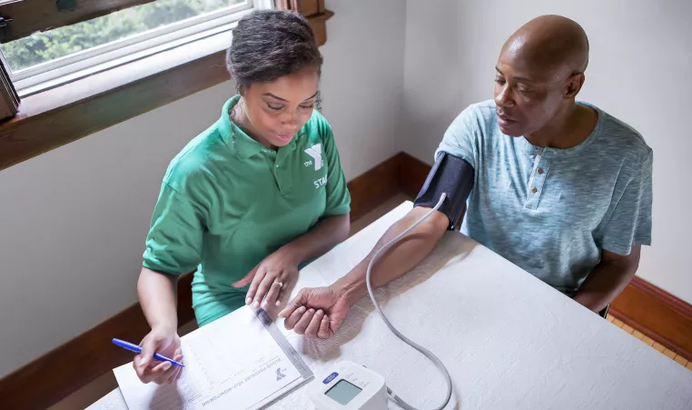 Two people tracking blood pressure.