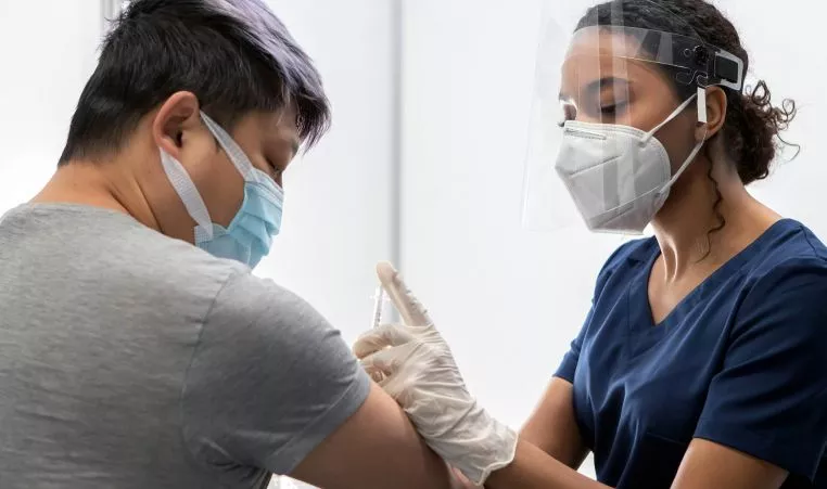 Person receiving vaccine