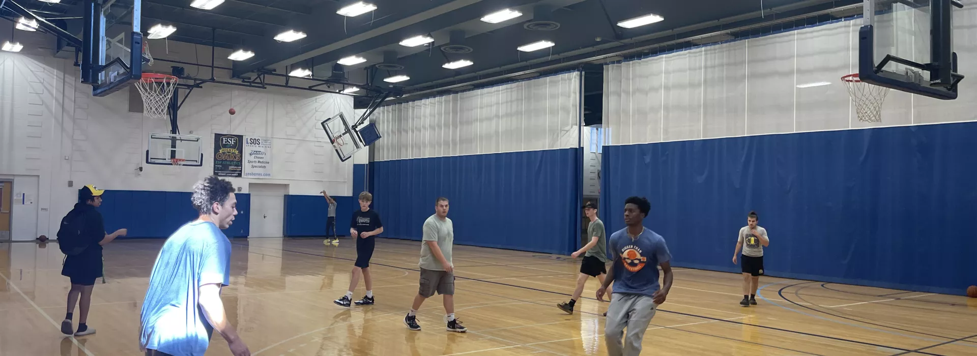 basketball court with kids playing basketball