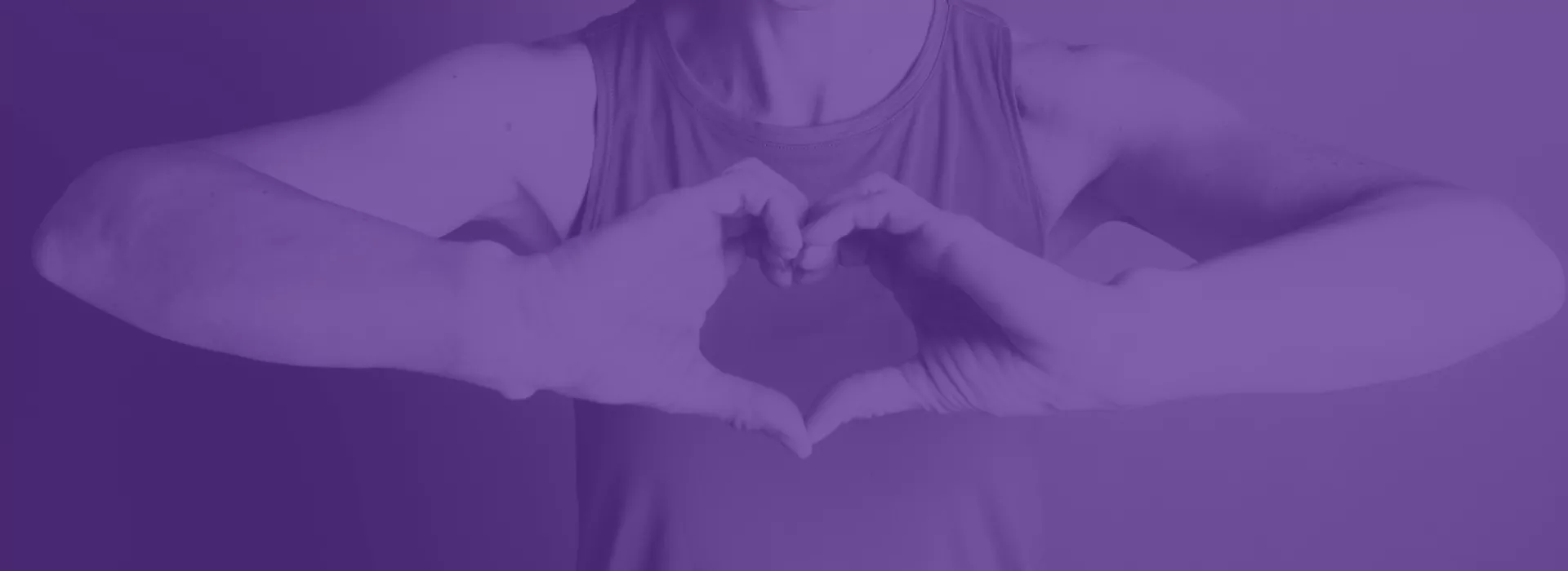 Person making a heart with their hands